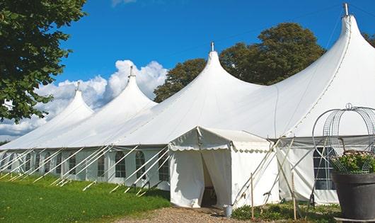 high-quality portable restrooms stationed at a wedding, meeting the needs of guests throughout the outdoor reception in Lathrup Village